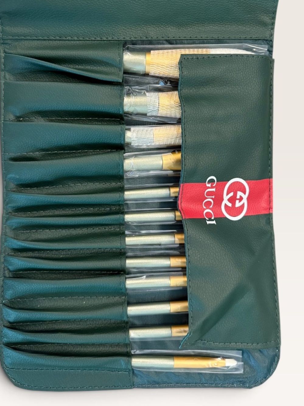 Source Unknown Green Brush Roll with Red Stripe and Gold-Tone Brushes